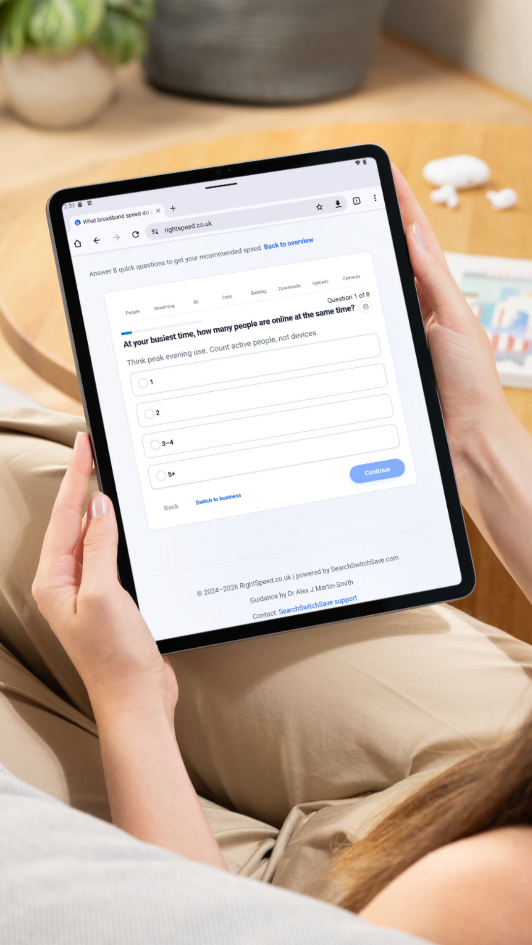 Sister-site fairness check: RightSpeed.co.uk by SearchSwitchSave A person using RightSpeed.co.uk on a tablet to answer the question 'At your busiest time, how many people are online at the same time?'